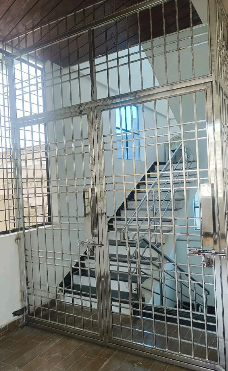 Stainless steel slat partition beside a staircase