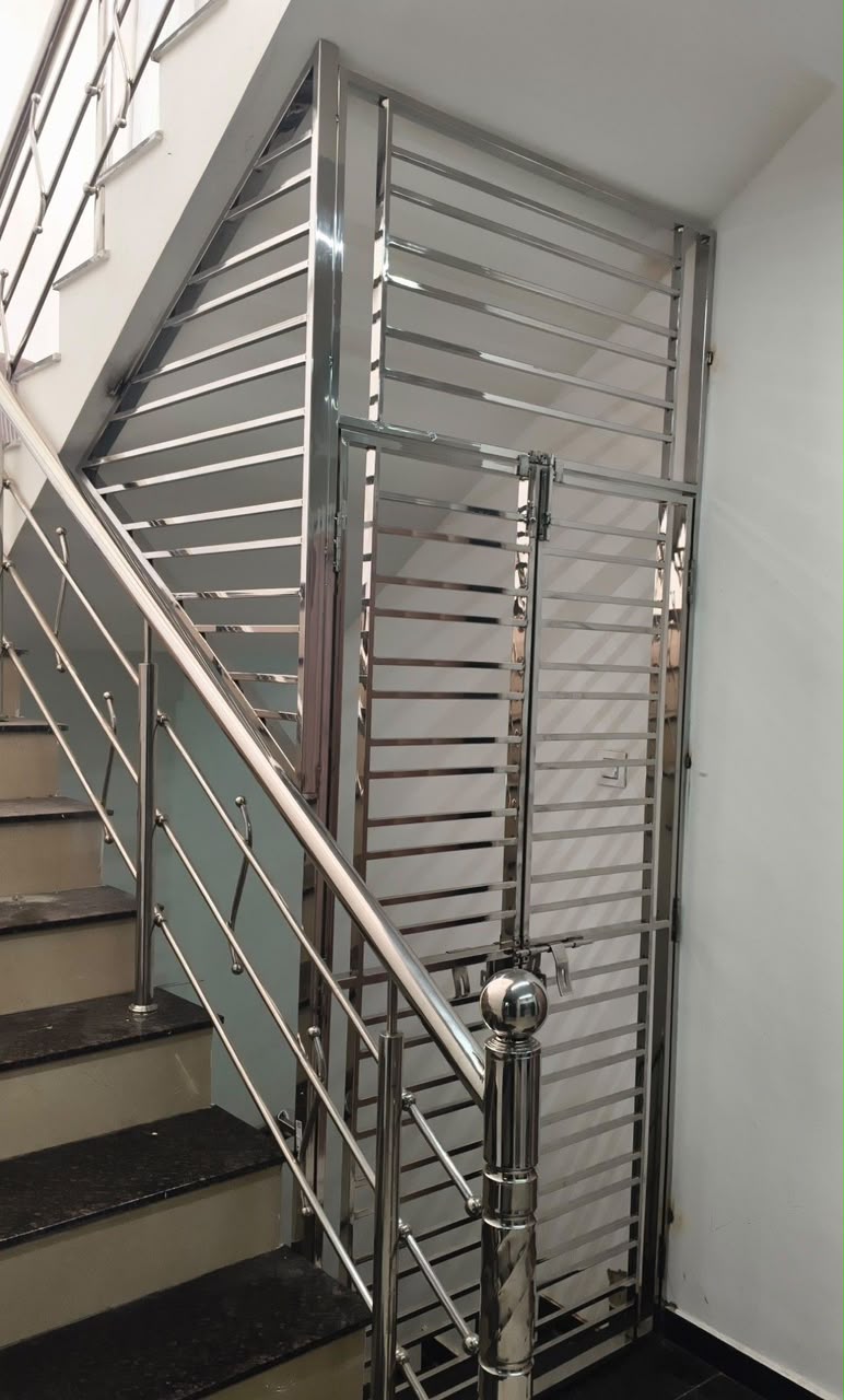 Stainless steel entrance gate with sunburst pattern